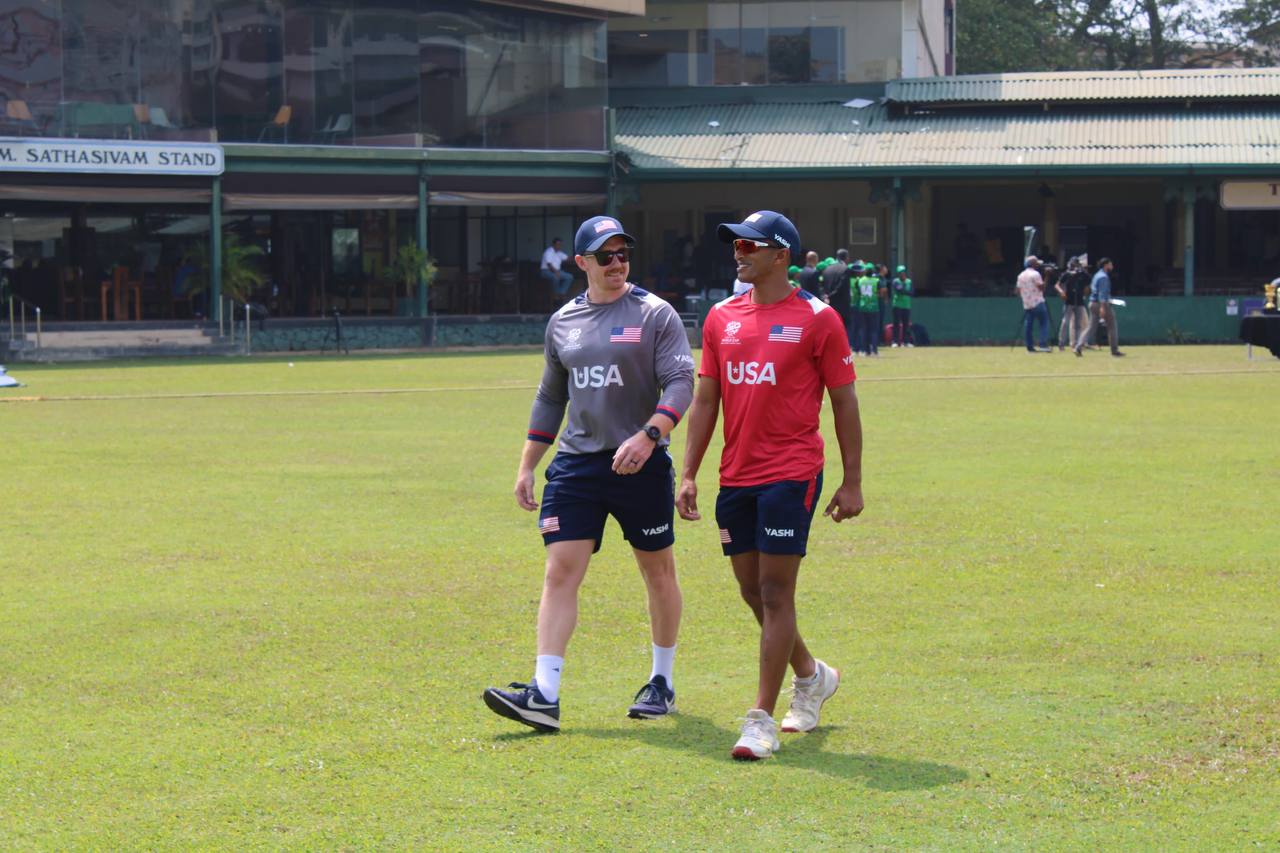 Mathew Skyner walking with a USA Cricket athlete during a training day